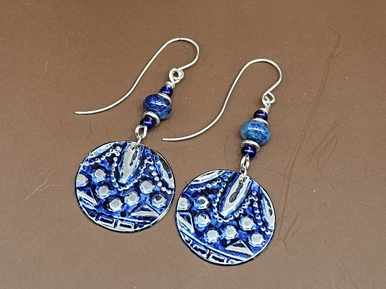 Dangle earrings, pewter discs embossed with a pattern and painted blue with blue lapis lazuli and pewter rondelles