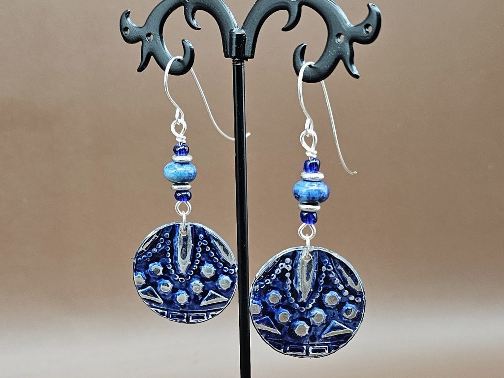 Dangle earrings, pewter discs embossed with a pattern and painted blue with blue lapis lazuli and pewter rondelles