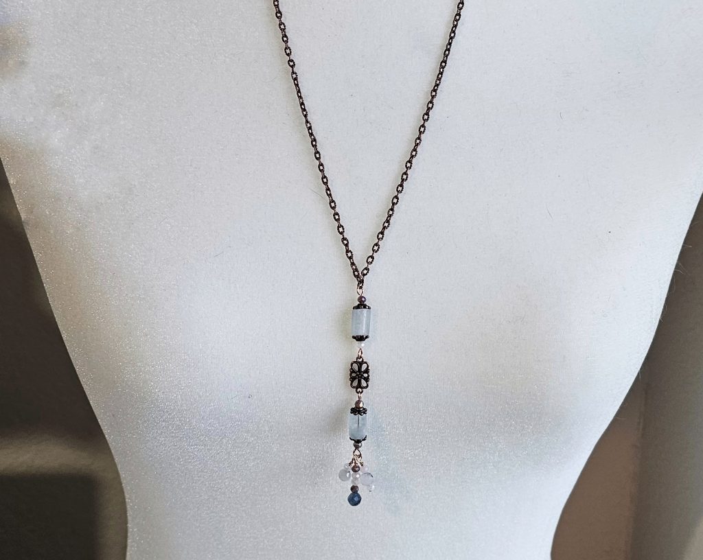 Necklace that is 26 Inches plus 3 Inch long drop, featuring
Aquamarine barrel beads
Copper accents and chain
Handmade Hook Clasp