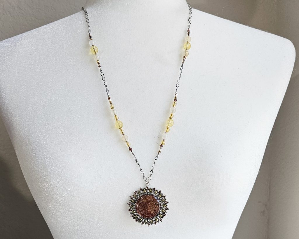 Handmade citrine necklace with antique silver resin pendant, hand colored with alcohol ink and accented with glass seed beads.