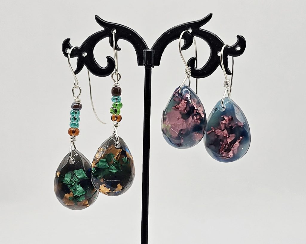 Finished earrings made with the UV resin dangles, one with glass seed beads and the other with just silver wire.